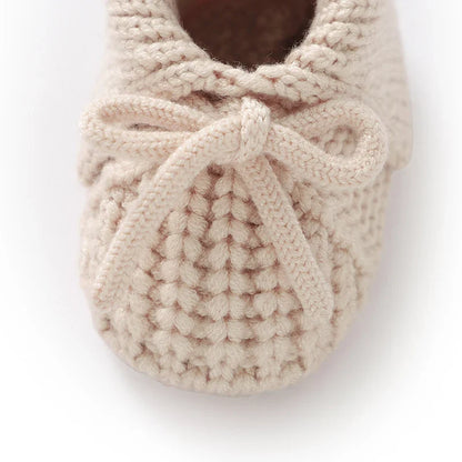 Cream-colored knitted baby moccasins, handmade soft sole crib shoes for babies 0-18 months
