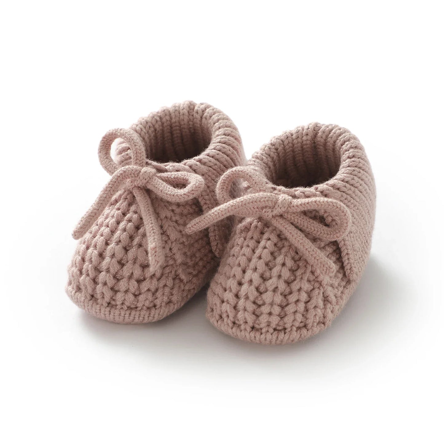Knitted baby booties in a soft green hue, gentle infant footwear for growing babies 0-18 months
