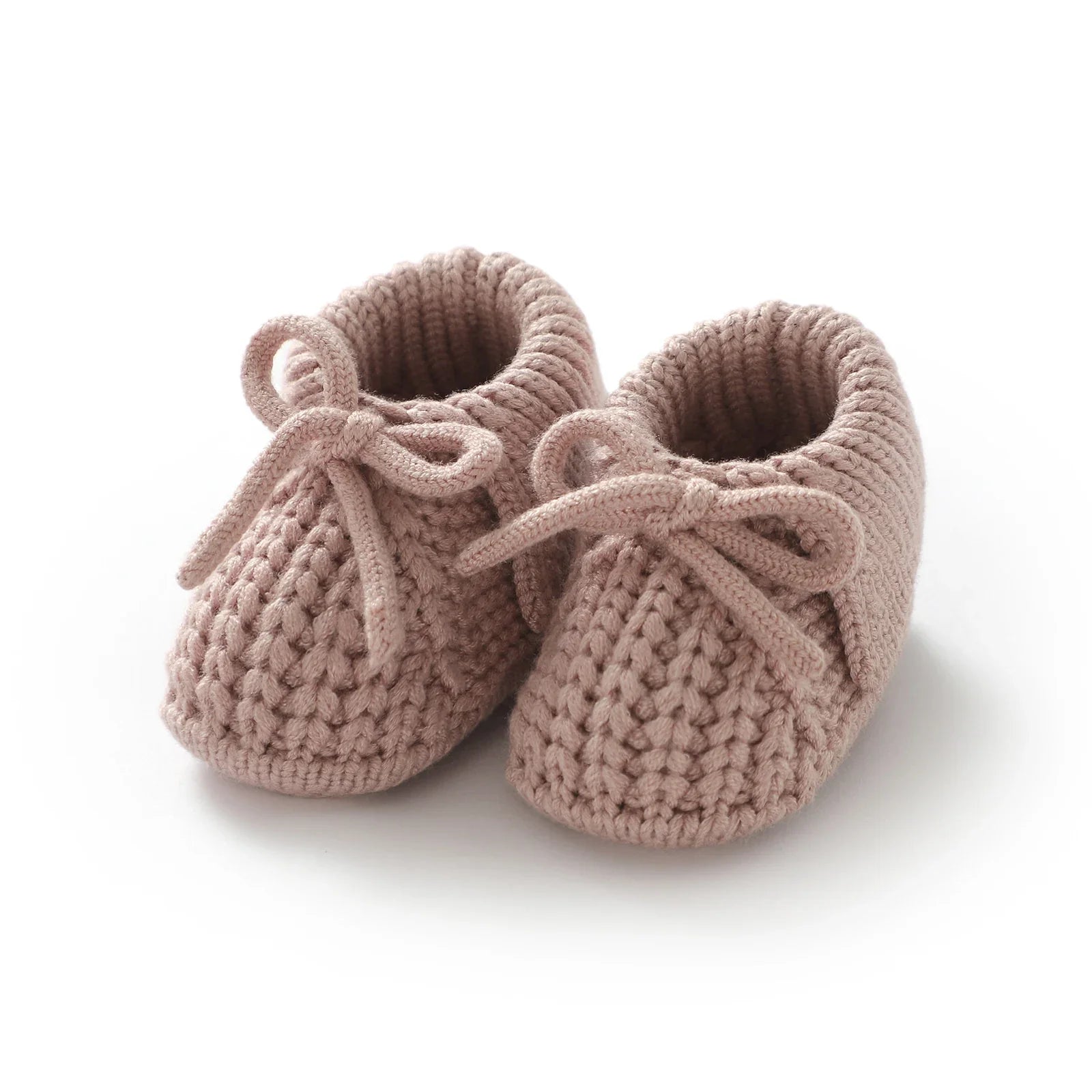 Knitted baby booties in a soft green hue, gentle infant footwear for growing babies 0-18 months