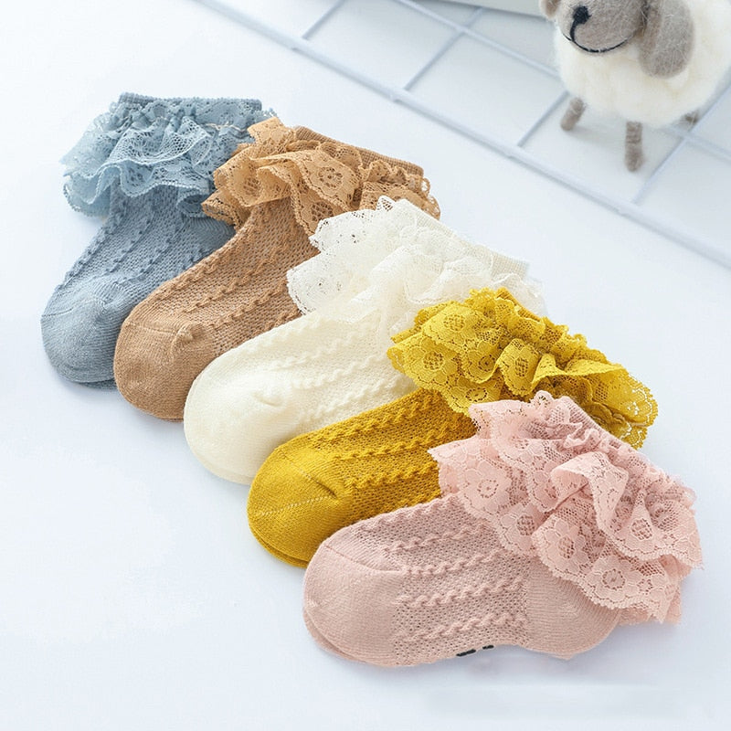 Adorable white lace ruffle ankle socks for baby girls, soft cotton blend