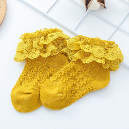 Set of three pairs of colorful lace ruffle socks for baby and toddler girls