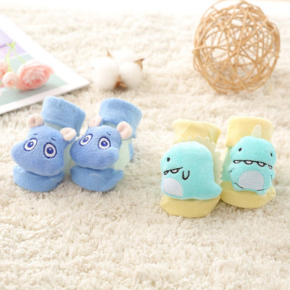 Collection of anti-slip baby socks for infants, vibrant animal prints on soft cotton for comfort and style.