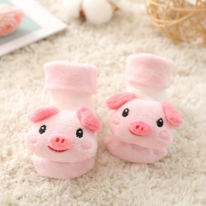 Cute pink pig infant anti-slip socks for babies, comfortable cotton, ideal for new walkers.