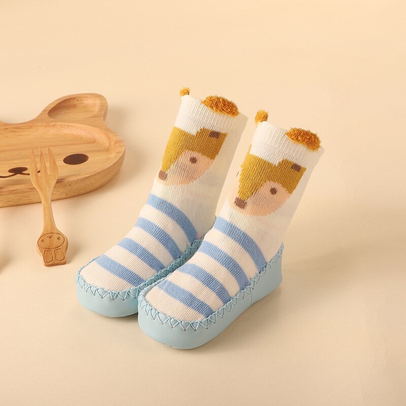 Soft wool blend anti-slip baby socks featuring a playful bear design, ensuring warm and secure footing.