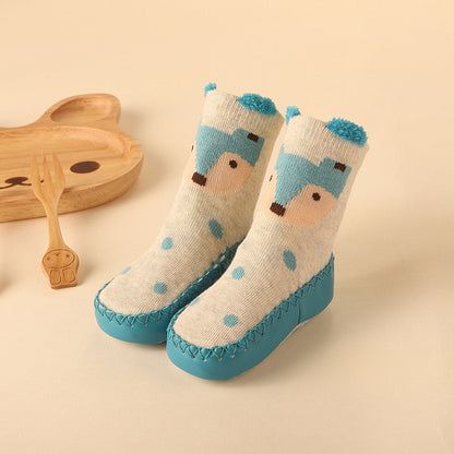 Striped baby anti-slip socks in blue and white, designed as firstwalker booties for active toddlers.