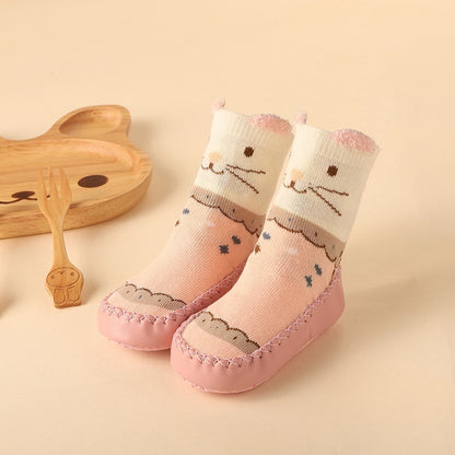 Pink elephant anti-slip baby socks with strong grips, offering comfort and safety for little ones' feet.