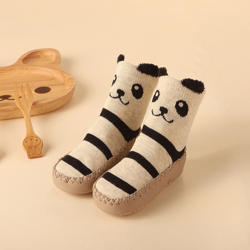 Cozy baby anti-slip socks with a cheerful fox design, providing warmth and stability for infants' first steps.
