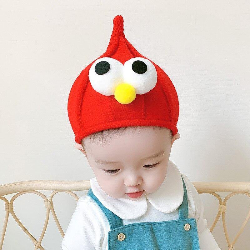 Adorable yellow kids winter beanie with large googly eyes, perfect for a unisex toddler.