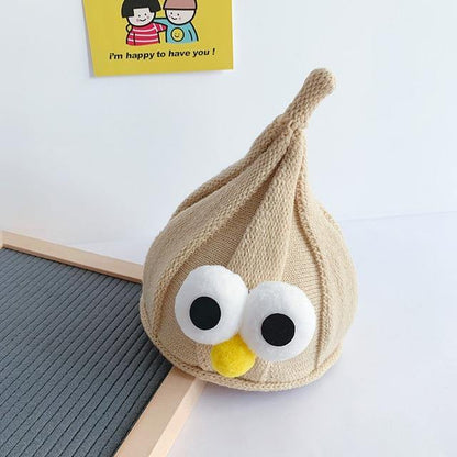 Infant modeling a pink googly eyes hat, a charming and warm accessory for babies.