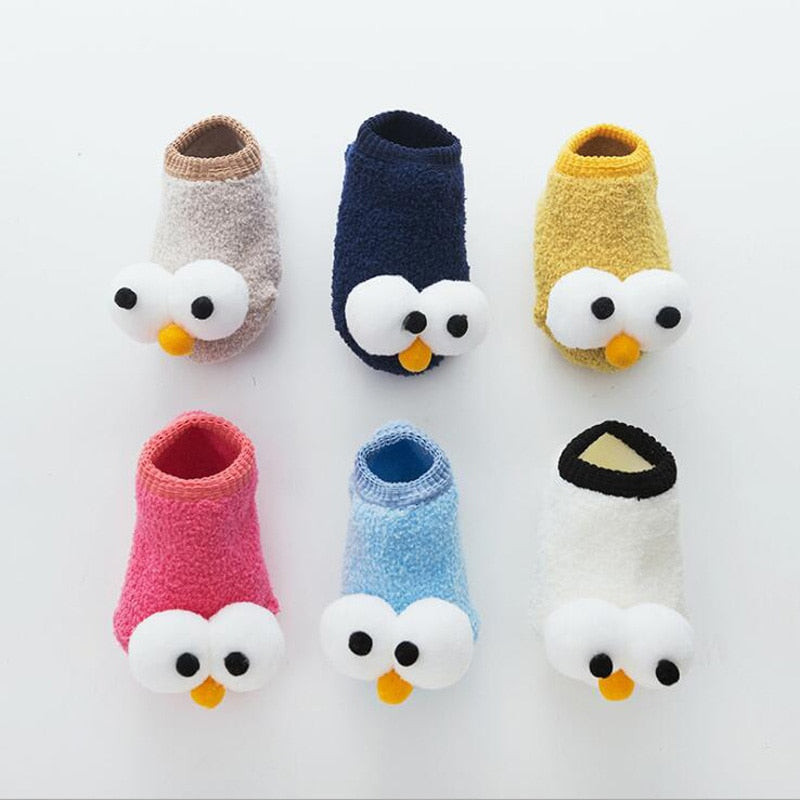 Adorable yellow toddler boat socks with large embroidered eyes, soft cotton for baby comfort.