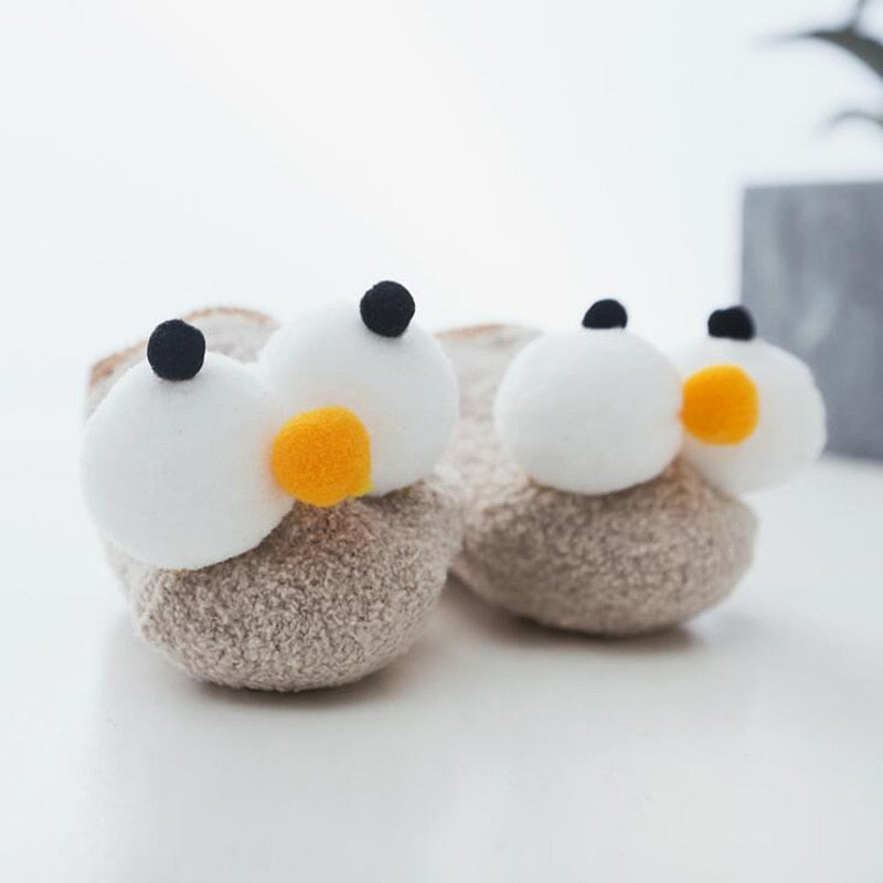 Close-up of a white big eye baby boat sock, highlighting the cute embroidered design and quality fabric.
