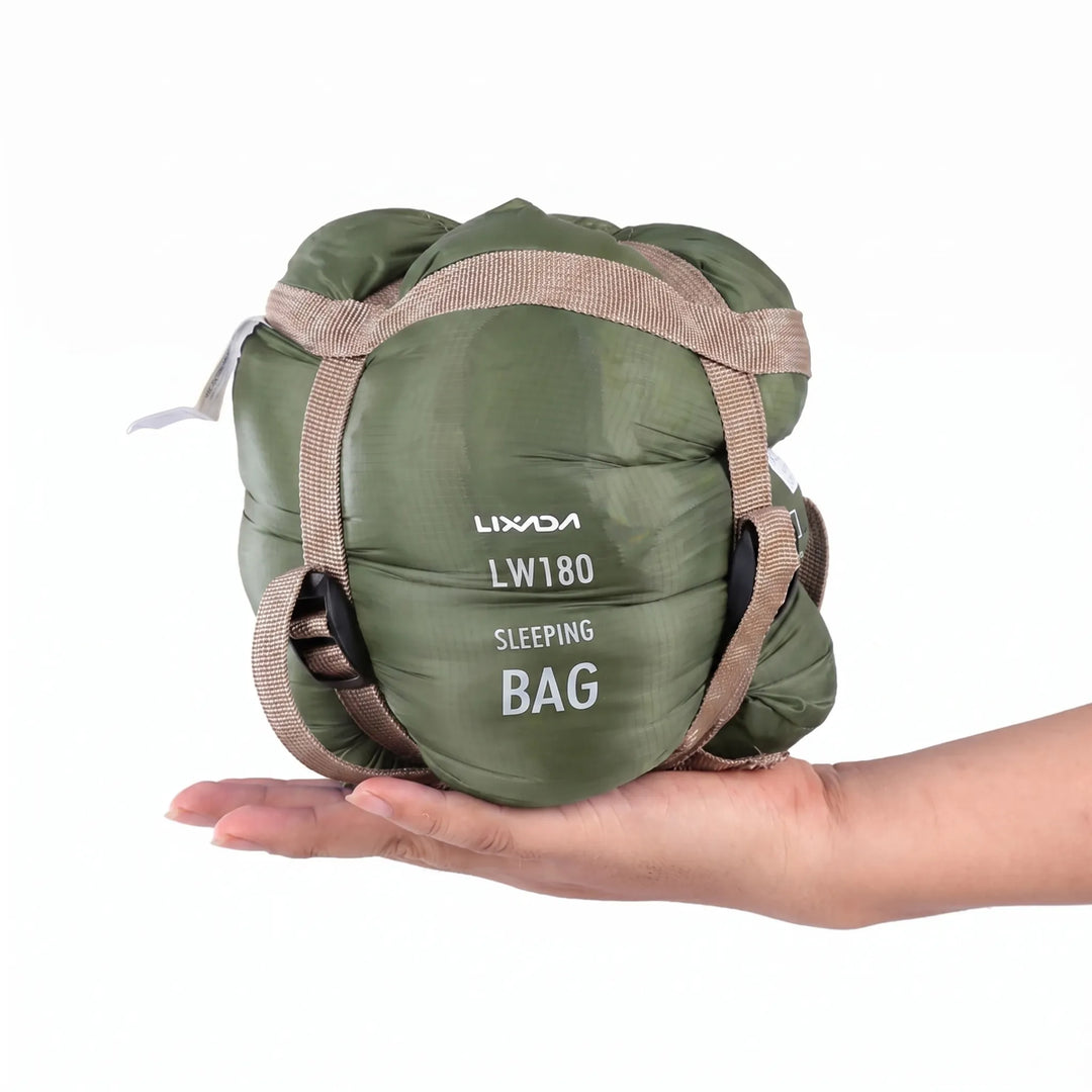 Packed ultralight compact adult's sleeping bag, ready for travel, hiking, and camping adventures.