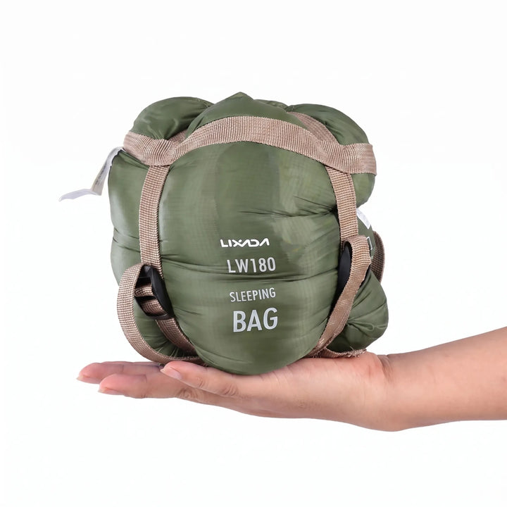 Packed ultralight compact adult's sleeping bag, ready for travel, hiking, and camping adventures.