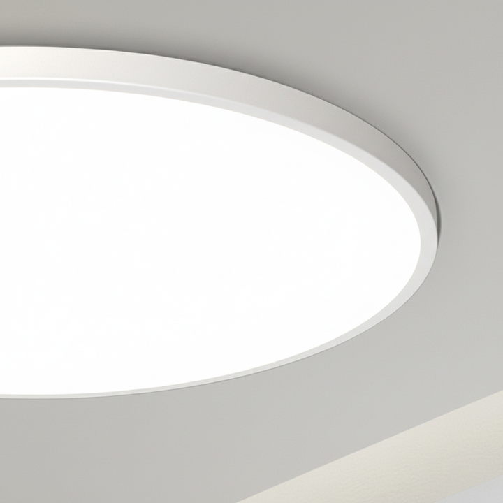 Flat minimalist AuraSphere LED ceiling light providing warm, inviting ambient illumination for modern home decor.