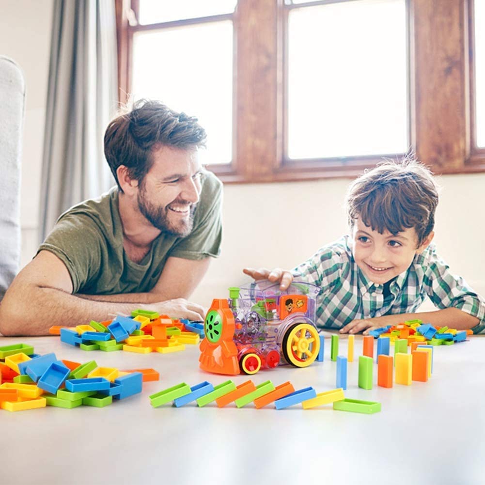 Kids automatic domino laying train set, creating a fun domino chain for creative play.
