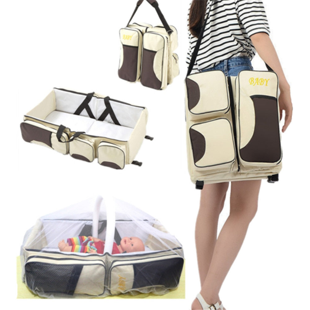 Baby 3-in-1 portable travel diaper bag & bassinet with changing station, ideal for newborn essentials on the go.