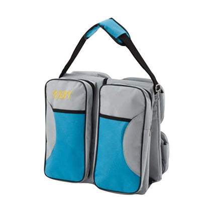 Compact baby travel diaper bag transforming into a portable bassinet for infant bed and changing station.
