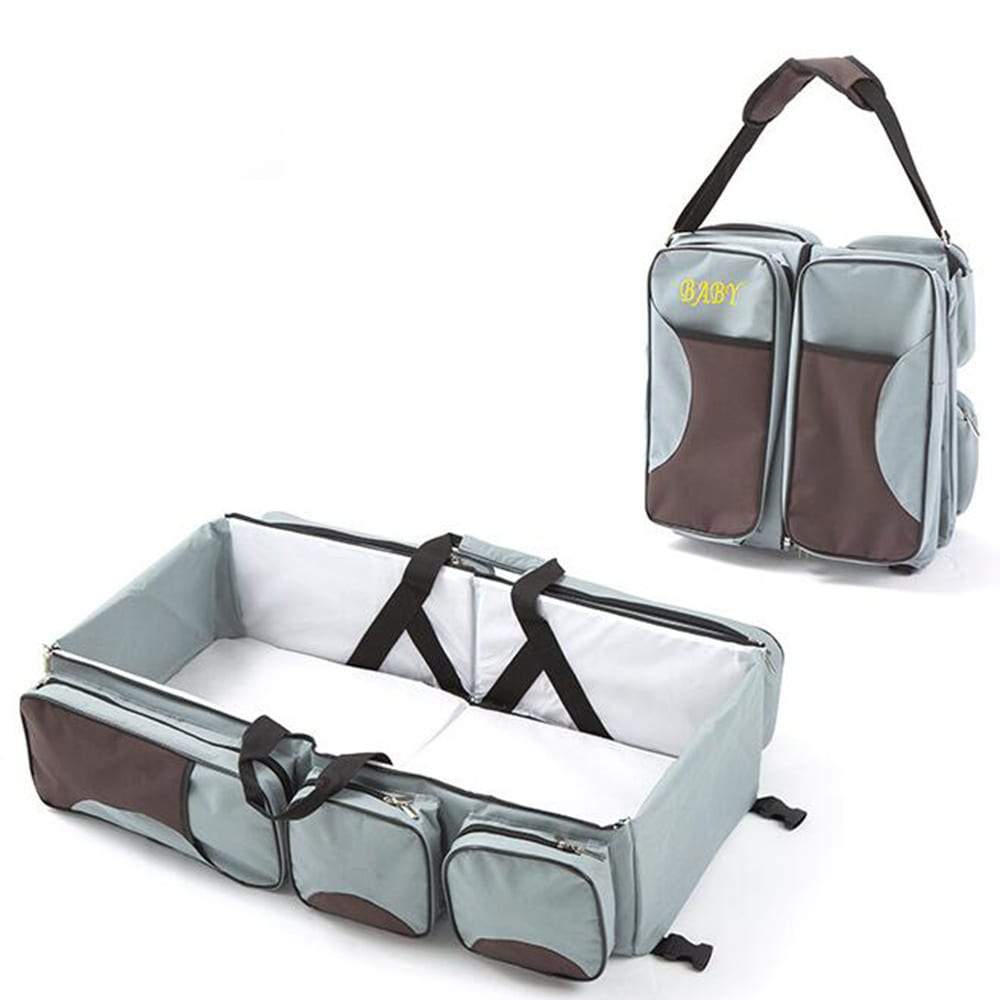 Open 3-in-1 baby travel bag showing spacious organizer pockets and comfortable portable bassinet.
