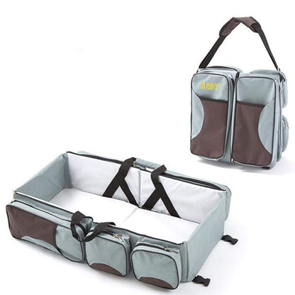 Open 3-in-1 baby travel bag showing spacious organizer pockets and comfortable portable bassinet.