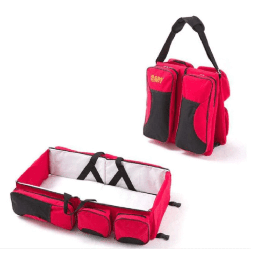 Newborn essentials: fully set up portable bassinet with changing station, integrated into a travel diaper bag.