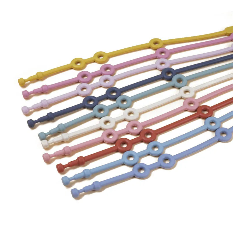 Baby adjustable silicone toy strap in blue secures a rattle to a high chair, preventing drops.