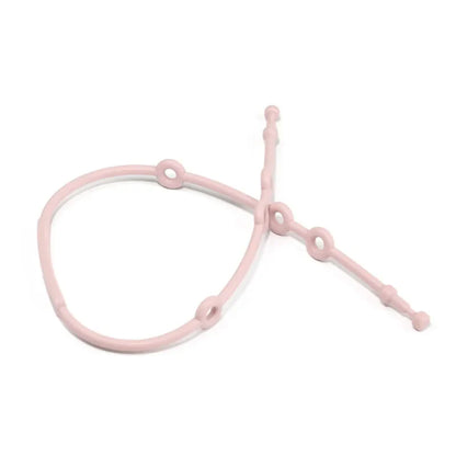 Baby gear essential: a blue adjustable silicone toy strap preventing a soft toy from falling to the ground.