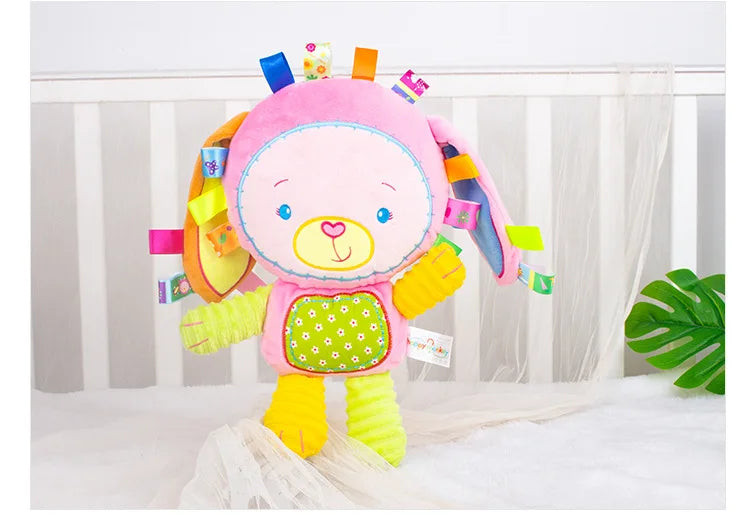 Baby friendly elephant plush toy with rattles and bells, ideal for sensory play