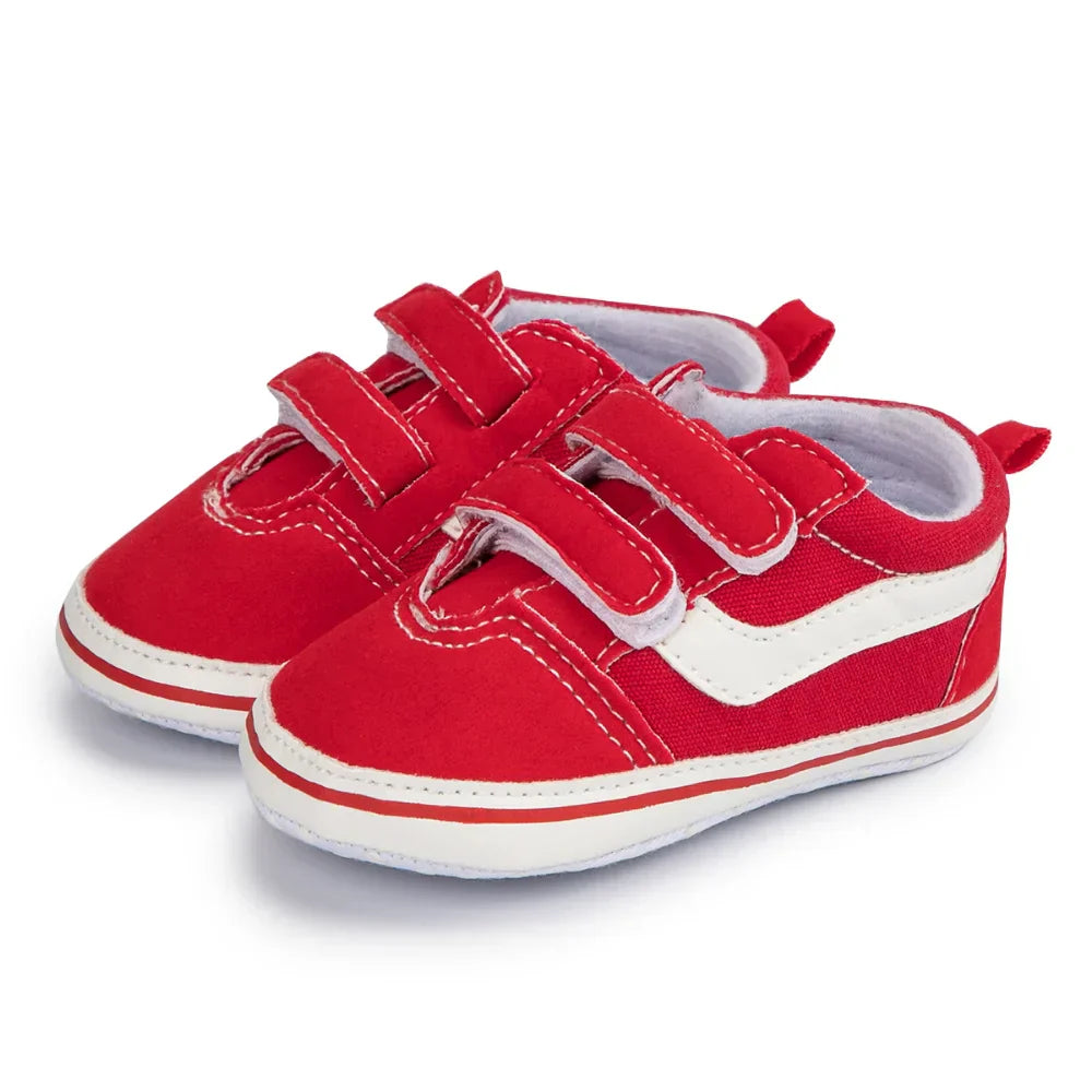 Close-up of baby anti-slip canvas sneaker, detailing velcro strap and soft sole technology