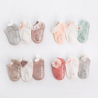 Overhead view of multi-colored anti-slip grip socks for babies, toddlers, essential children's apparel