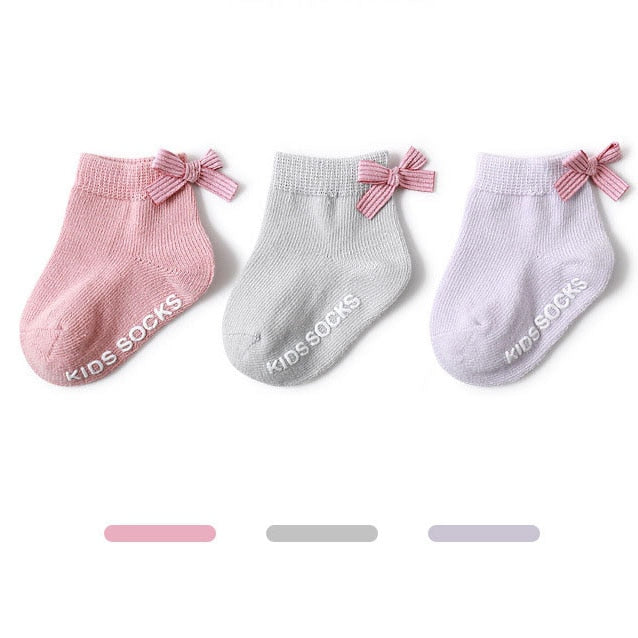 Infant anti-slip cotton grip socks in pink with cute animal design, essential baby clothing accessory