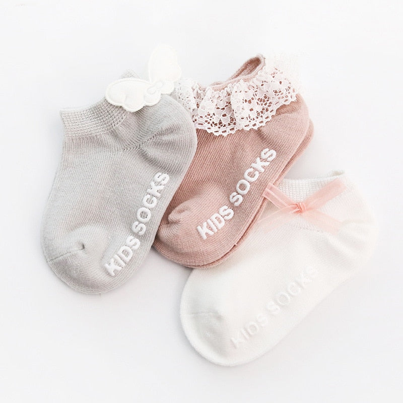 Close-up of anti-slip silicone grippers on the sole of baby cotton socks, ensuring safe walking