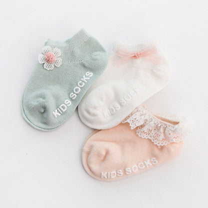Child's foot in a cozy anti-slip cotton grip sock, ideal for indoor play and comfortable wear