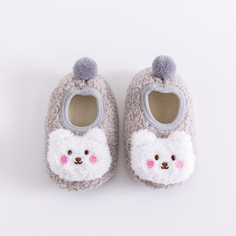 Pair of infant anti-slip cotton socks with an adorable bear face on the ankle
