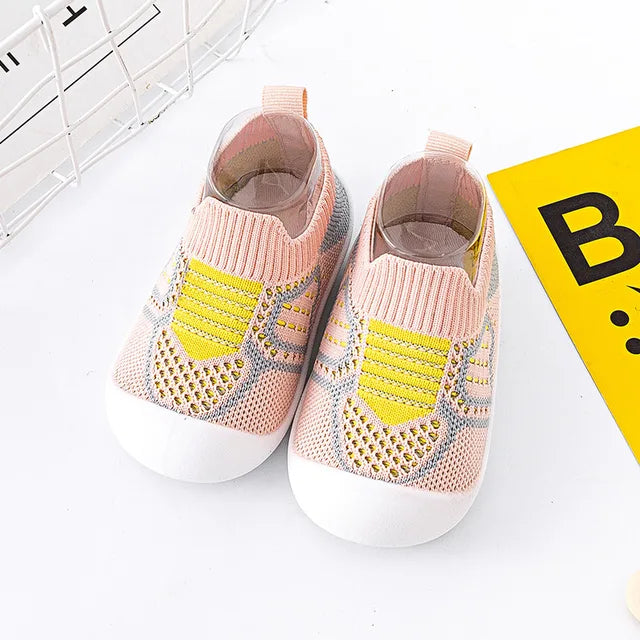 Baby Anti-Slip First Walker Shoes with elastic ankle support for secure fit on toddlers.