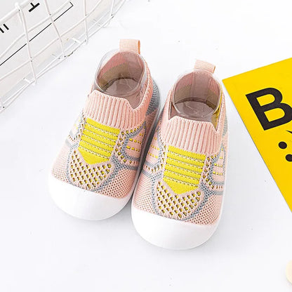 Baby Anti-Slip First Walker Shoes with elastic ankle support for secure fit on toddlers.