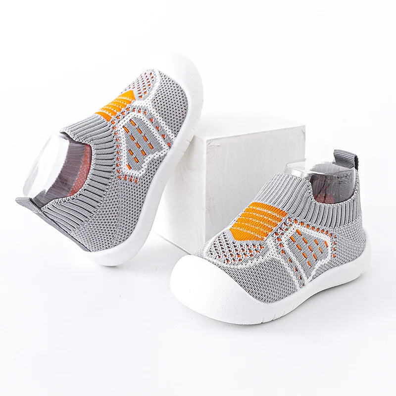 Toddler wearing Baby Anti-Slip First Walker Shoes, demonstrating flexibility and comfort.