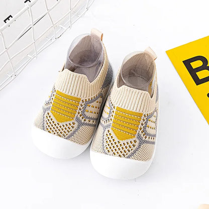 Infant feet in Baby Anti-Slip First Walker Shoes, promoting stable steps for baby gear.