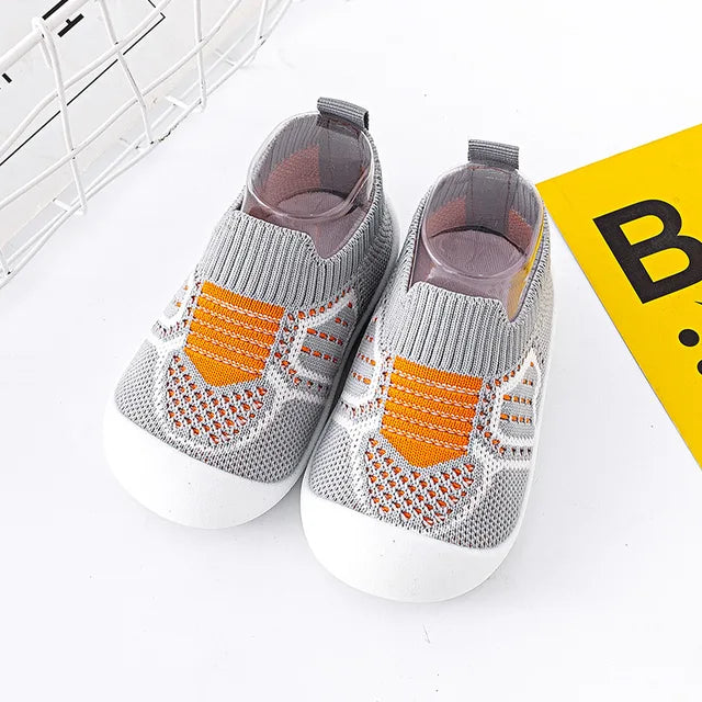 Collection of colorful Baby Anti-Slip First Walker Shoes, soft sole for diverse infant outfits.