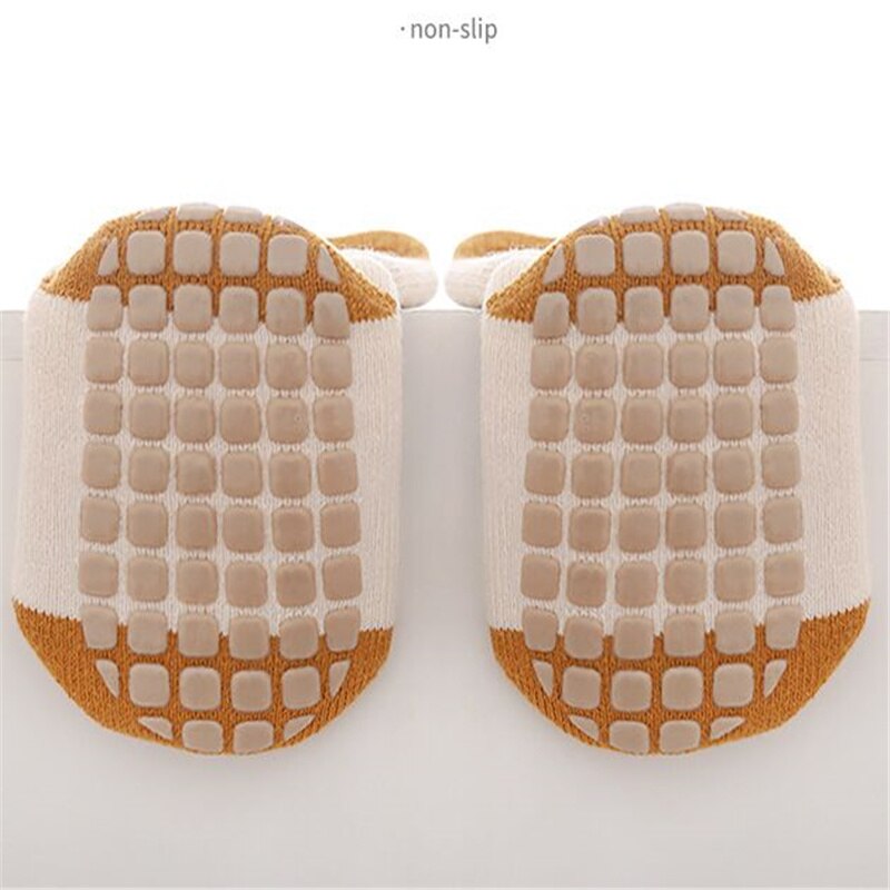 Toddler floor socks with anti-slip bottom, essential baby clothing for new walkers.