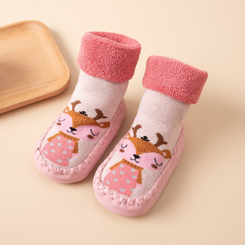 Anti-slip baby socks featuring colorful geometric patterns, ideal for crawling