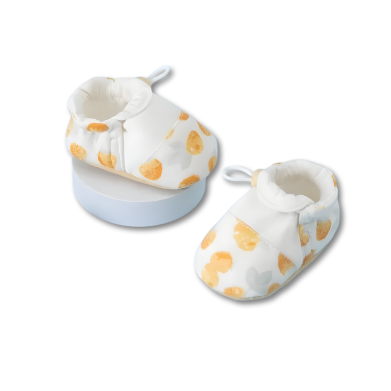 Baby booties designed for comfort and safety, with anti-slip features for active infants.