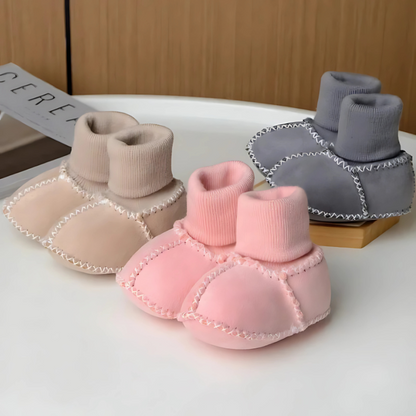 Baby anti-slip warm first walker boots, soft sole for newborns, essential infant footwear.