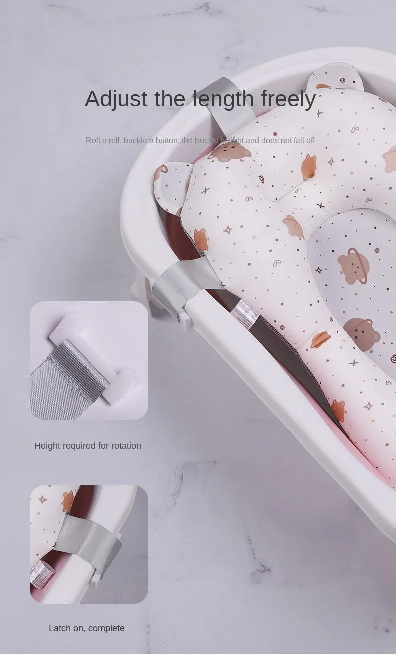 Soft non-slip bath support pad for newborns, shown in a clean bathroom setting