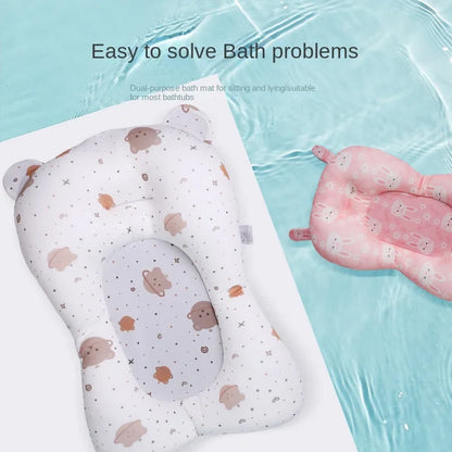 Newborn baby securely resting on a non-slip foldable bath support pad in a bathtub