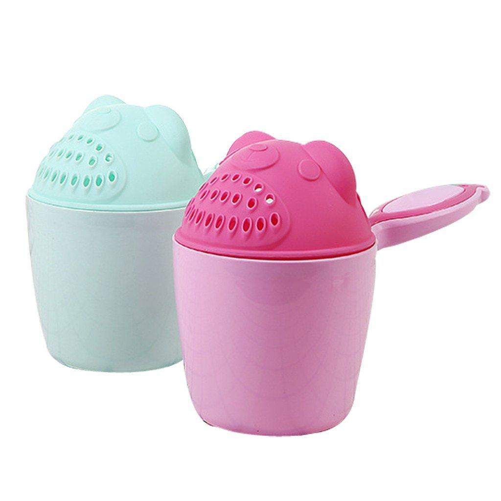 Toddler holding a yellow baby bath rinser, making hair washing fun and easy, bath time accessory