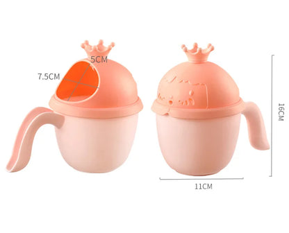 Newborn essentials bath kit in pastel colors, featuring a soft bath brush and rinse cup