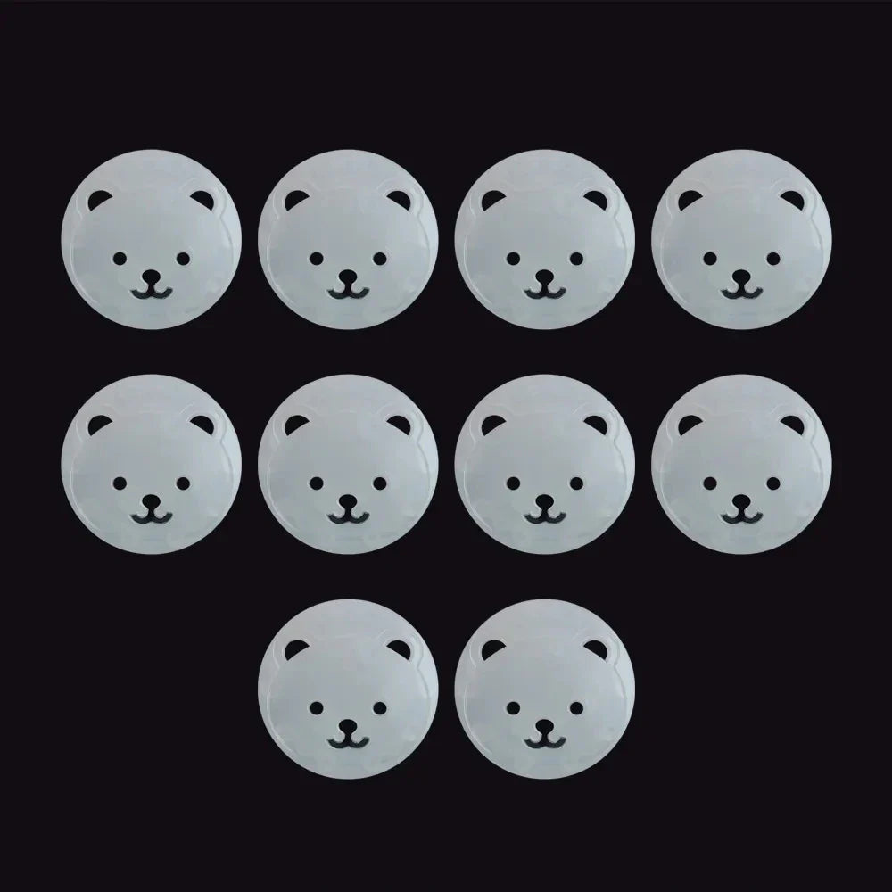 Side view of a white bear socket cover, highlighting its secure fit as a child safety plug protector.