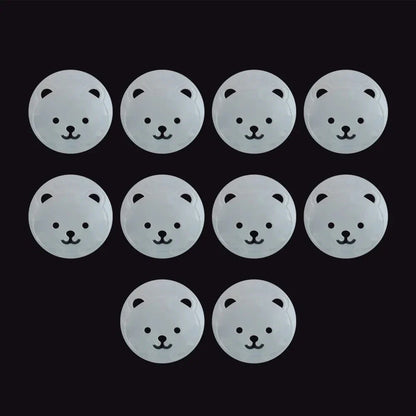 Side view of a white bear socket cover, highlighting its secure fit as a child safety plug protector.