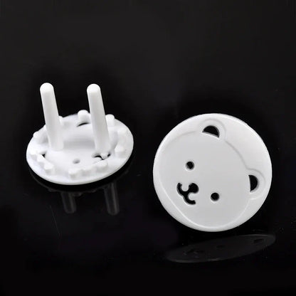Child safety plug protectors, white bear design, shown on an electrical outlet for baby proofing.