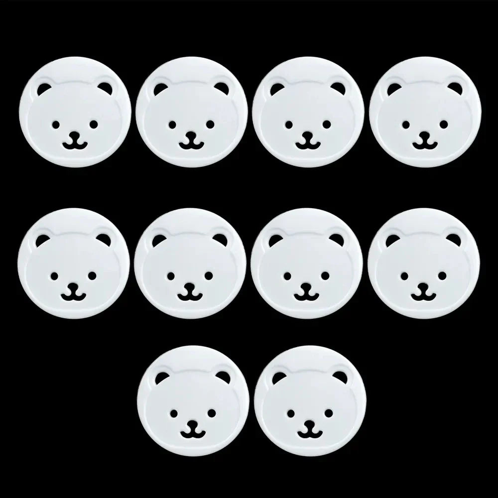 Full set of 10 white baby bear socket covers, designed for comprehensive child electrical safety in homes.
